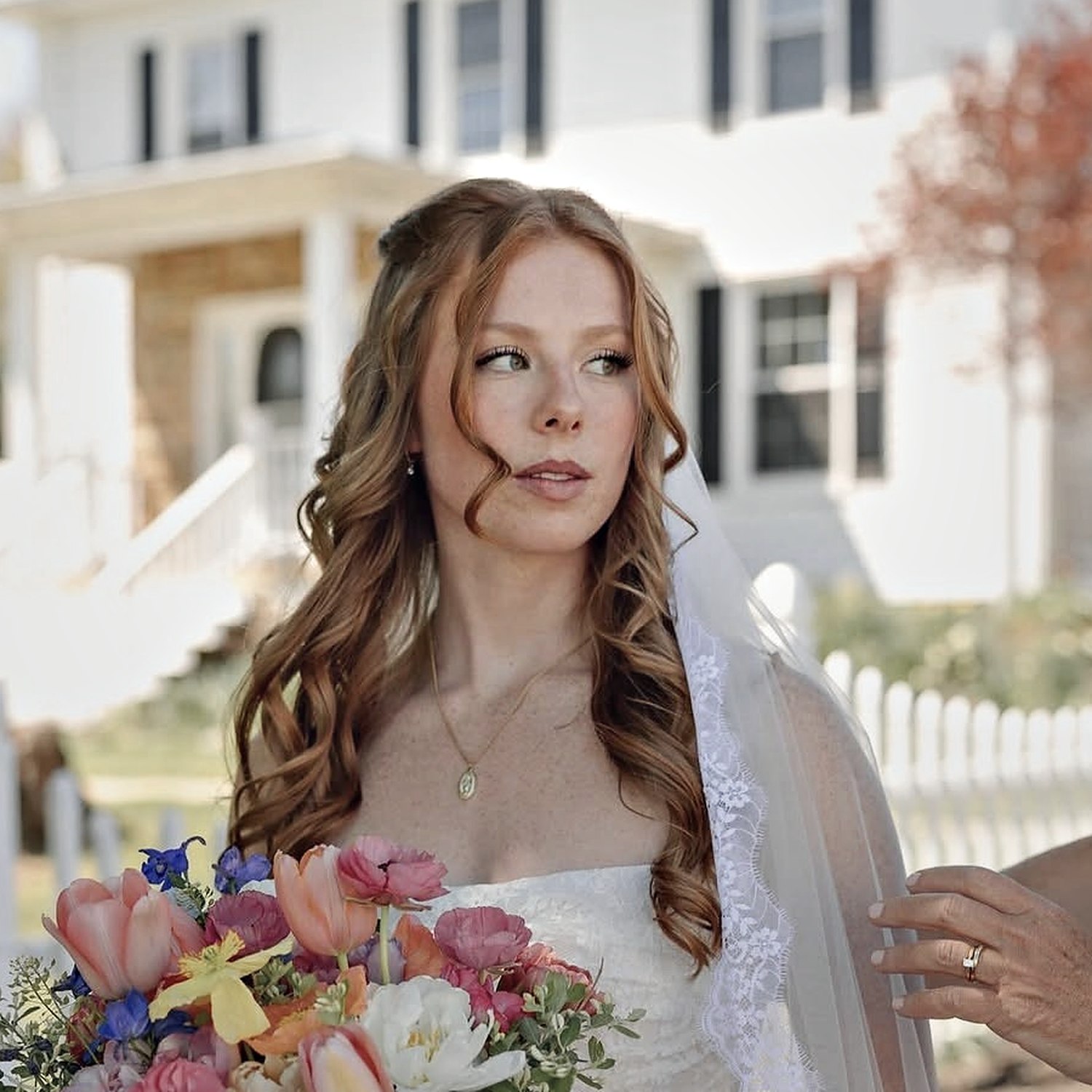 Bride with soft long-wear makeup and curls